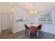 Bright dining area featuring wood-style floors and a pass-through to the kitchen at 6826 Stones Throw N Cir # 11308, St Petersburg, FL 33710