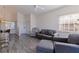 Cozy condo living room featuring stylish decor and modern wood grain floors at 6826 Stones Throw N Cir # 11308, St Petersburg, FL 33710