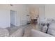 Bright and spacious living room showcasing wood-style flooring and an open layout with a dining area at 6826 Stones Throw N Cir # 11308, St Petersburg, FL 33710