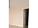 Bright bedroom featuring neutral paint and a door at 7031 Drury St, Tampa, FL 33635