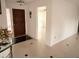 Inviting foyer with ceramic tile flooring, chandelier, and access to other rooms at 7031 Drury St, Tampa, FL 33635