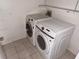 Laundry area featuring a Samsung front-load washer and dryer for convenient laundry care at 7031 Drury St, Tampa, FL 33635