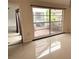 Bright living room featuring ceramic tile flooring and a large window at 7031 Drury St, Tampa, FL 33635