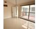 Bright living room featuring ceramic tile flooring and a large window at 7031 Drury St, Tampa, FL 33635
