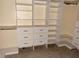 Custom walk-in closet with built-in shelving, drawers, and ample storage space at 7031 Drury St, Tampa, FL 33635