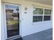 Exterior view of the unit's entrance and front window with natural light at 802 Brandy Wine Dr # 802, Largo, FL 33771