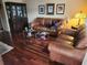 Cozy living room with hardwood floors and leather furnishings at 802 Brandy Wine Dr # 802, Largo, FL 33771