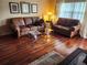 Living room with hardwood floors and traditional style furnishing, including a Tiffany lamp at 802 Brandy Wine Dr # 802, Largo, FL 33771