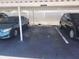 Designated carport parking with limited space between vehicles and privacy fencing at 802 Brandy Wine Dr # 802, Largo, FL 33771