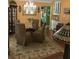 The formal dining room offers elegant lighting and neutral tones at 8101 Roxboro Dr, Hudson, FL 34667