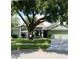 Charming single-Gathering home with a mature tree and well-maintained lawn at 8101 Roxboro Dr, Hudson, FL 34667