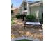 The front yard is decorated with a bench and unique shrubbery at 8101 Roxboro Dr, Hudson, FL 34667