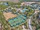 Overhead shot of neighborhood amenities including tennis courts, pool, recreation center and playground with parking at 8320 Manor Club Cir # 4, Tampa, FL 33647