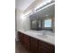 This bathroom features a double vanity, granite countertop, soaking tub, and a glass shower at 8320 Manor Club Cir # 4, Tampa, FL 33647