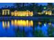 An illuminated 'Grand Hampton' sign, reflecting in the water, welcomes you to the community at 8320 Manor Club Cir # 4, Tampa, FL 33647