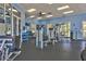 Spacious community gym with ceiling fan and recessed lighting, lots of workout equipment and a water cooler at 8320 Manor Club Cir # 4, Tampa, FL 33647