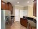 Kitchen with stainless steel appliances, dark granite countertops, and tile flooring at 8320 Manor Club Cir # 4, Tampa, FL 33647