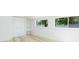 Bright basement featuring light floors, closets and windows at 9445 Cardy St, New Port Richey, FL 34654