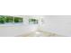 Bright basement featuring light floors and windows at 9445 Cardy St, New Port Richey, FL 34654