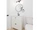 Modern bathroom featuring a vanity, round mirror and toilet at 9445 Cardy St, New Port Richey, FL 34654