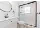 Modern bathroom featuring a walk-in shower with glass door and black hardware at 9445 Cardy St, New Port Richey, FL 34654