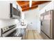 Close-up of kitchen featuring stainless steel appliances, and white cabinets at 9445 Cardy St, New Port Richey, FL 34654