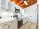 Updated kitchen with stainless steel appliances, quartz countertops, and white subway tile backsplash at 9445 Cardy St, New Port Richey, FL 34654