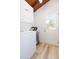 Laundry room with stacked washer/dryer and access to outside at 9445 Cardy St, New Port Richey, FL 34654