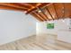 Bright and spacious open concept living room featuring wood floors and painted walls, perfect for modern living at 9445 Cardy St, New Port Richey, FL 34654