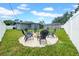 Spacious backyard featuring a fire pit surrounded by seating, perfect for entertaining at 9801 56Th N St, Pinellas Park, FL 33782