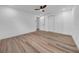 Empty bedroom featuring wood floors, base board trim, a ceiling fan and closet at 9801 56Th N St, Pinellas Park, FL 33782
