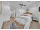 Comfortable bedroom with wood floors, an area rug and easy access to the bathroom at 9801 56Th N St, Pinellas Park, FL 33782