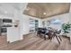 Bright dining area featuring a wood table, modern chairs, and view of the pool at 9801 56Th N St, Pinellas Park, FL 33782