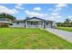Charming single-story home with a well-maintained lawn and freshly painted exterior at 9801 56Th N St, Pinellas Park, FL 33782