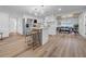 Bright kitchen with stainless appliances and an island with bar seating open to the dining area at 9801 56Th N St, Pinellas Park, FL 33782