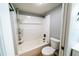 This bathroom features a shower and tub combo, complemented by a sleek, elongated toilet at 10196 Seminole Island Dr, Largo, FL 33773