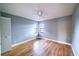 Spacious bedroom with wood-look flooring, neutral walls, and two windows at 10196 Seminole Island Dr, Largo, FL 33773