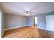 Bedroom with wood-look flooring and ensuite bathroom at 10196 Seminole Island Dr, Largo, FL 33773