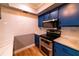 Kitchen boasts new stainless steel microwave and oven plus updated cabinets at 10196 Seminole Island Dr, Largo, FL 33773