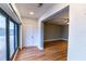 Bright living room with hardwood floors, window, and open doorway at 10196 Seminole Island Dr, Largo, FL 33773