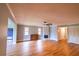 Inviting living room with hardwood floors, fireplace, and neutral paint at 10196 Seminole Island Dr, Largo, FL 33773