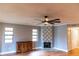 Living room featuring tile fireplace, and wood-look floors at 10196 Seminole Island Dr, Largo, FL 33773
