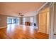 Spacious living room with hardwood floors, fireplace, and open floor plan at 10196 Seminole Island Dr, Largo, FL 33773