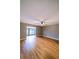 Open-concept living room featuring wood-look floors and a ceiling fan at 10196 Seminole Island Dr, Largo, FL 33773