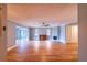 Spacious living room featuring a fan, fireplace, and hardwood floors at 10196 Seminole Island Dr, Largo, FL 33773