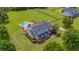 A beautiful home with a pool, mature trees and lush landscaping at 10510 Lithia Estates Dr, Lithia, FL 33547