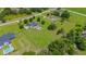 Aerial view of a spacious property featuring a well-maintained home, pool, and expansive lawn at 10510 Lithia Estates Dr, Lithia, FL 33547