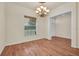 Bright dining room features wood floors, a large window, and elegant trim at 10510 Lithia Estates Dr, Lithia, FL 33547