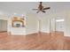 Open concept living room and kitchen features wood floors and lots of natural light at 10510 Lithia Estates Dr, Lithia, FL 33547