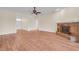 Bright living room with fireplace, ceiling fan, and wood floors at 10510 Lithia Estates Dr, Lithia, FL 33547
